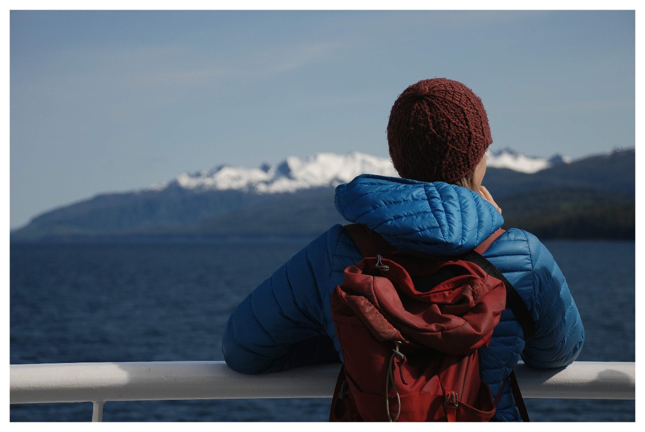 woman looking out from boat